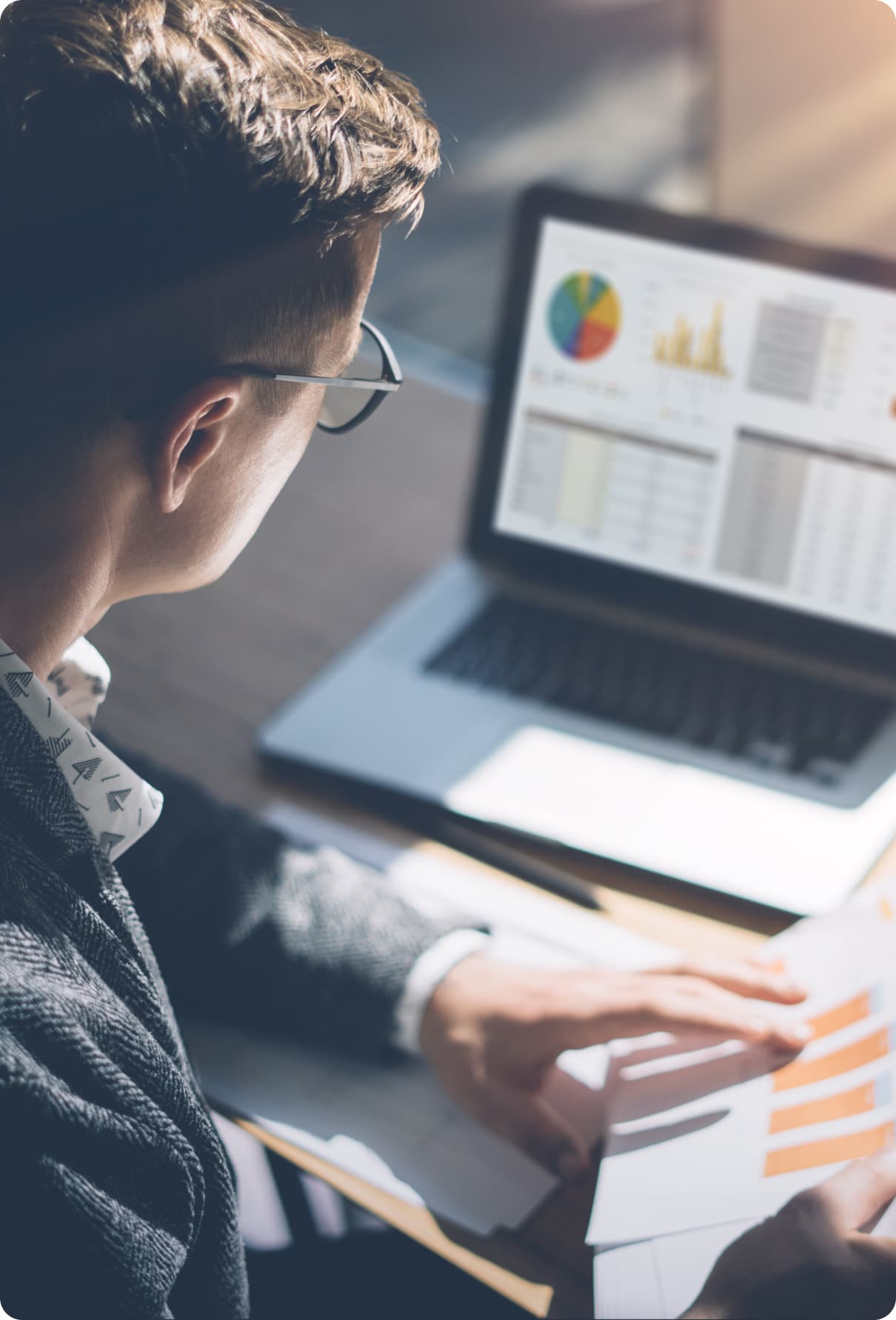A couple reviewing their investment statements at a kitchen table